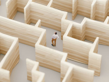 High angle view of man relaxing on wooden floor