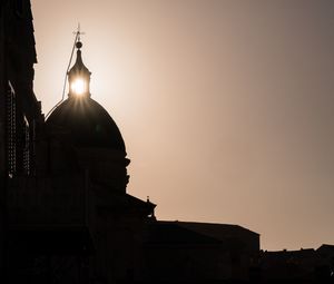 Silhouette of church at sunset