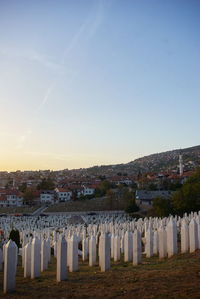View of cemetery against clear blue sky