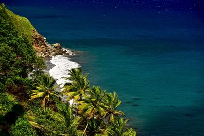 High angle view of sea against blue sky