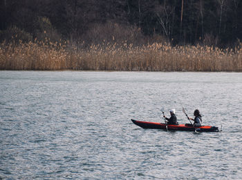 Men kayaking in river