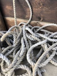 Close-up of rope tied on wood