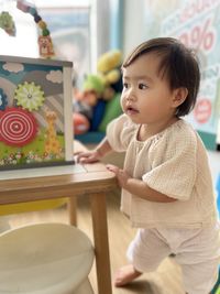 Portrait of cute girl using laptop at home