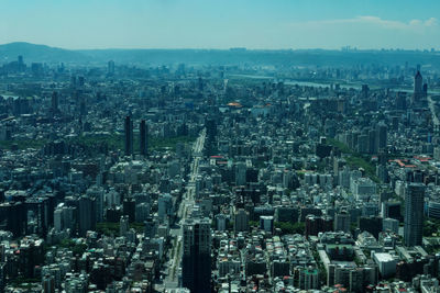 High angle view of modern buildings in city against sky