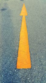 High angle view of arrow symbol on road