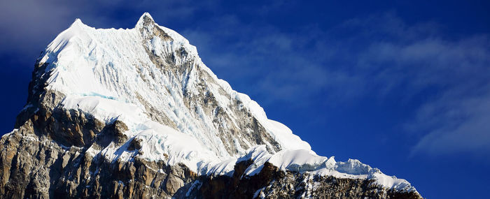 View of snowcapped mountain peak against sky