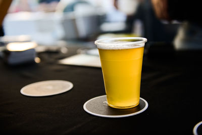 Close-up of beer in glass on table