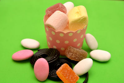 Close-up of multi colored candies on table