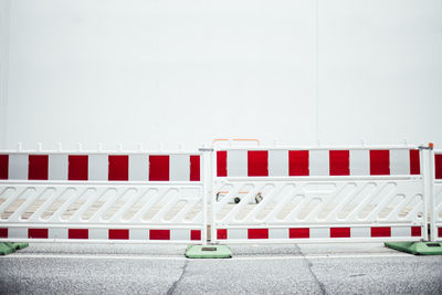 Full frame shot of road block against white wall 