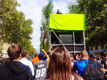 Rear view of people at music concert in city