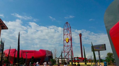 Amusement park ride against sky