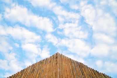 Low angle view of building against cloudy sky