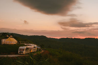 Sunrise in morning with camping van on mountain