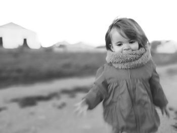 Portrait of boy on beach against sky