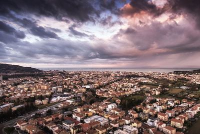 High angle shot of townscape against sky at sunset