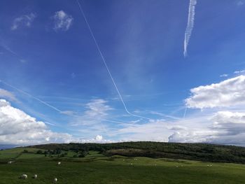 Scenic view of landscape against blue sky