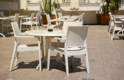 Empty chairs and tables in restaurant