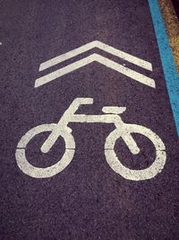 High angle view of bicycle sign on road