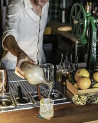 Midsection of man preparing food on table