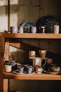 Cups on shelves at home