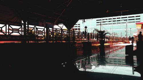 Silhouette of railroad station platform