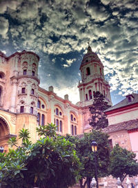 Low angle view of built structure against cloudy sky