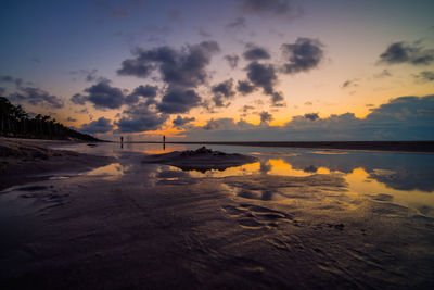 Scenic view of sea against sky at sunset