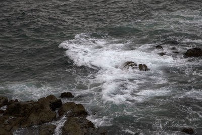 Waves splashing on rocks