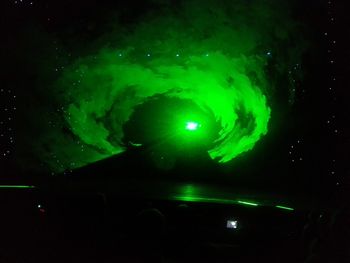 Low angle view of fireworks against sky at night