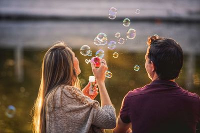 Rear view of women with bubbles