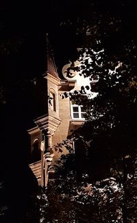 Low angle view of illuminated building at night