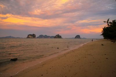 Scenic view of land against sky during sunset