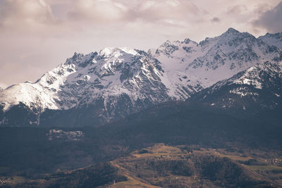 Scenic view of snowcapped mountains against sky