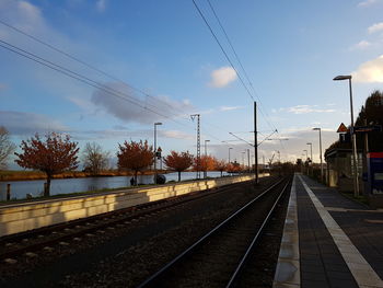 Train on railway tracks against sky
