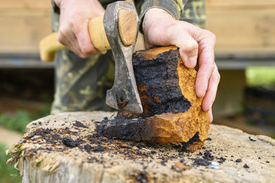 Close-up of man preparing food