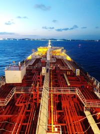 Aerial view of a vessel navigating against cloudy sky