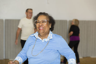 Senior people exercising in gym