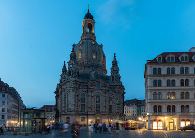 View of buildings in city at dusk