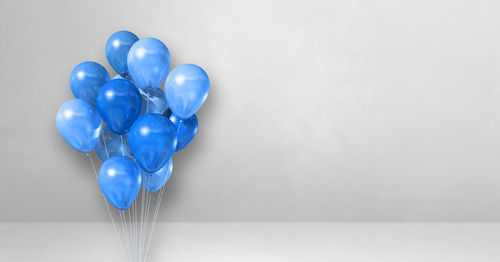 High angle view of heart shaped balloons against white background