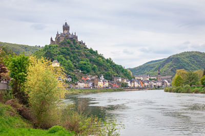 Picturesque view of a castle on a hill near the historic town of cochem along river moselle ,germany