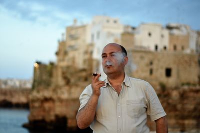 Man wearing sunglasses against sky