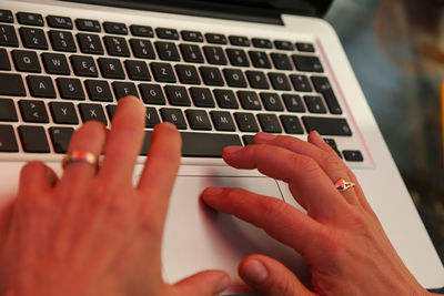 Close-up of hands using mobile phone