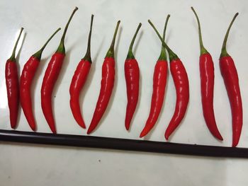 Close-up of red chili peppers on table