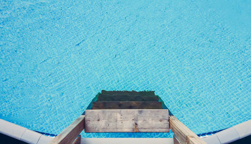 High angle view of ladder at swimming pool