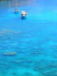 High angle view of boat sailing in sea