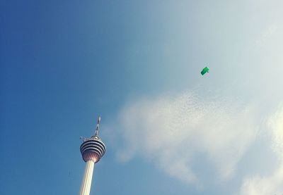 Low angle view of communications tower against sky