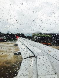 Waterdrops on glass with view of rainy season