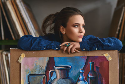 Portrait of young woman sitting on seat