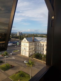 High angle view of road by city against sky