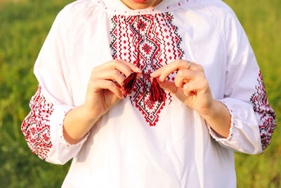 Midsection of woman holding gift